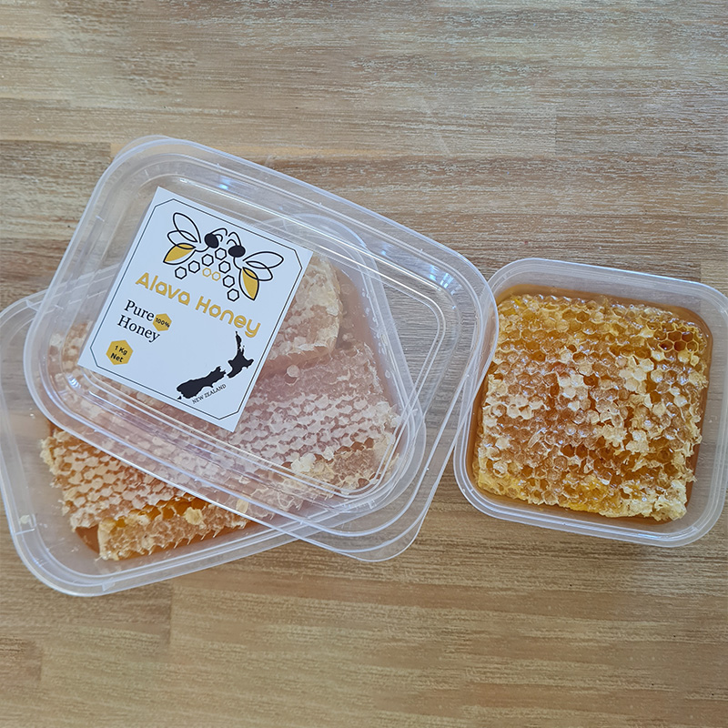 Two honeycomb containers side by side, Alava Honey label on top
